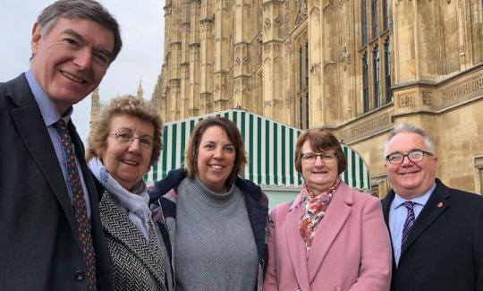 Philip Dunne MP with Judy Yapp, longest serving care assistant, Lindsay Giess, care manager, and Gill and Vince Burmingham, proprietors of Hendra House, at the House of Commons