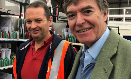 Philip Dunne MP with Ludlow Town postie of 31 years Phil Armitage