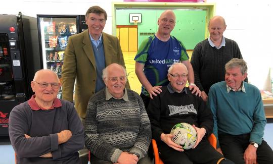 Philip Dunne praises local football for dementia group.